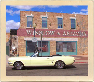 A cool, classic Mustang sits in front of a building in the town of Winslow, Arizona, the closest community to Meteor Crater.