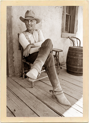 Robert Duvall relaxes on the set of “Lonesome Dove.” Notice the perspective on those boots!